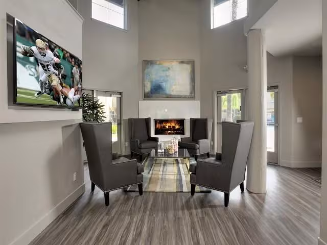 Spacious student lounge with high ceilings and fireplace