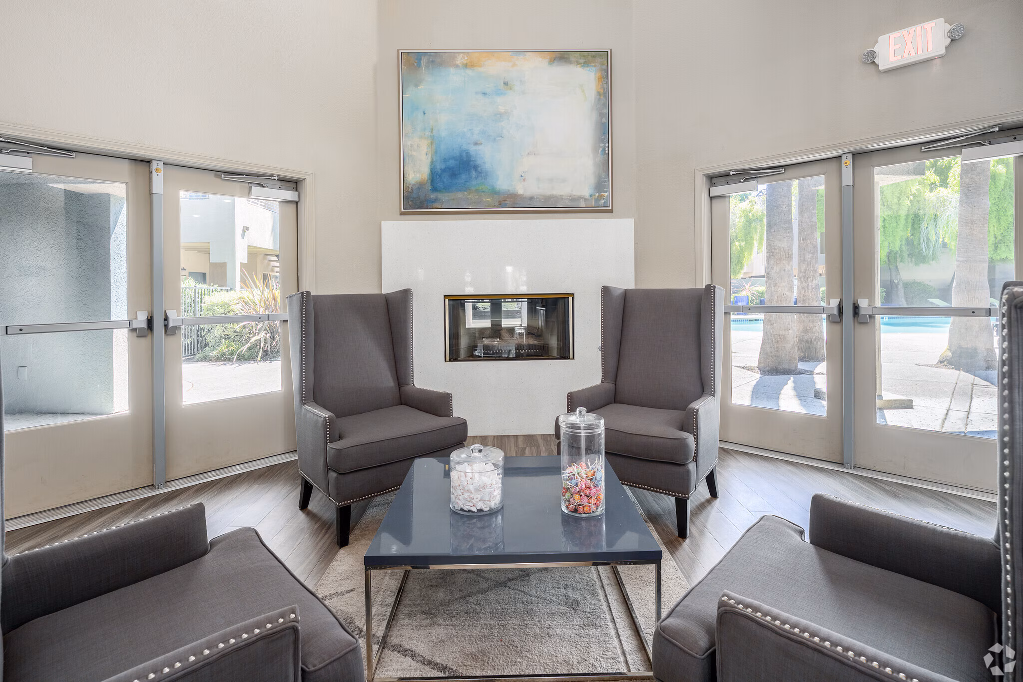 Resident clubhouse lounge with fireplace and comfortable seating