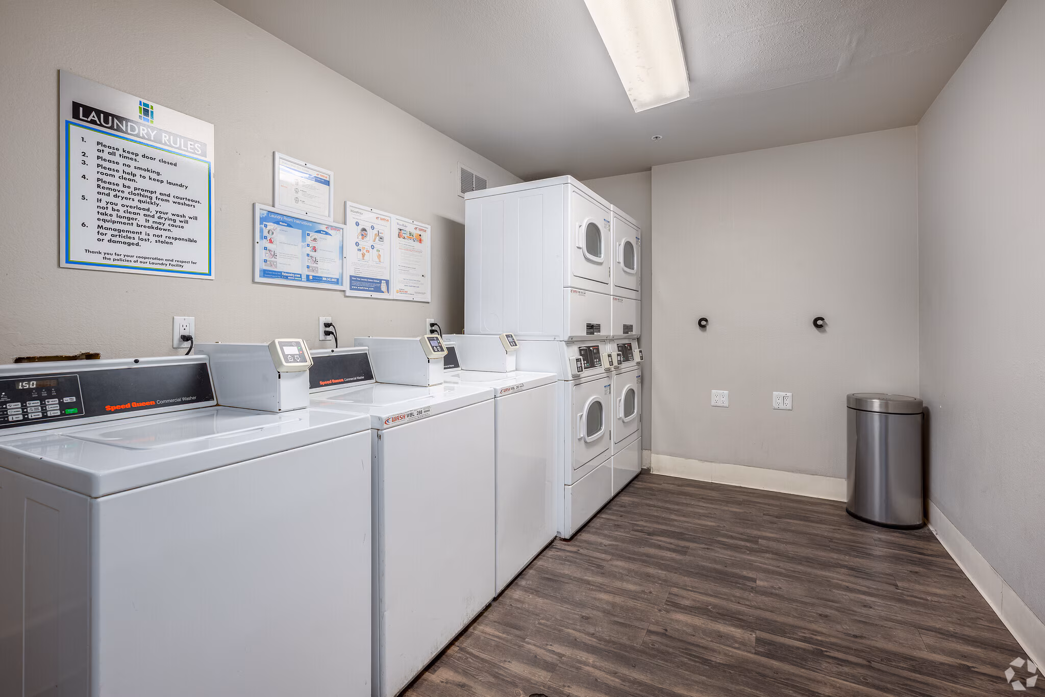 Community laundry room with washers and dryers at Sharps & Flats