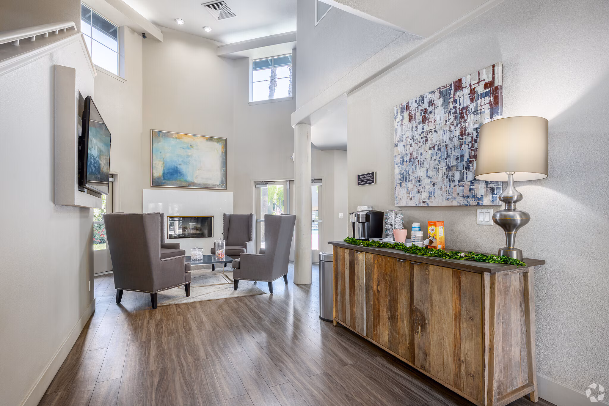 Bright apartment lobby with comfortable seating and modern furnishings